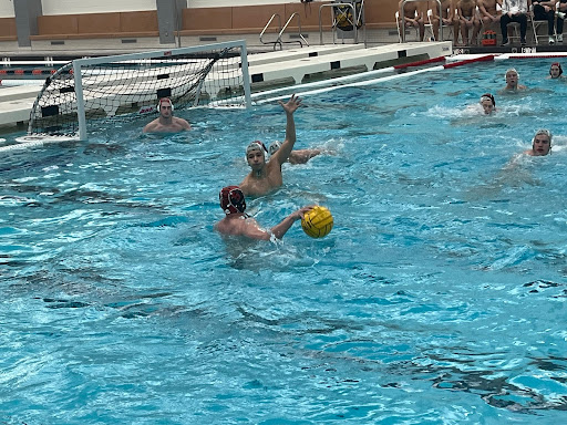 Senior Sam Rasin (5) takes the ball from the outskirts of the pool towards York’s goal. Rasin, who does swimming as well, is also one of four captains for the team, alongside fellow seniors Seif Kotb (7), Luke Kallieris (2) and Ali Tolba (3).