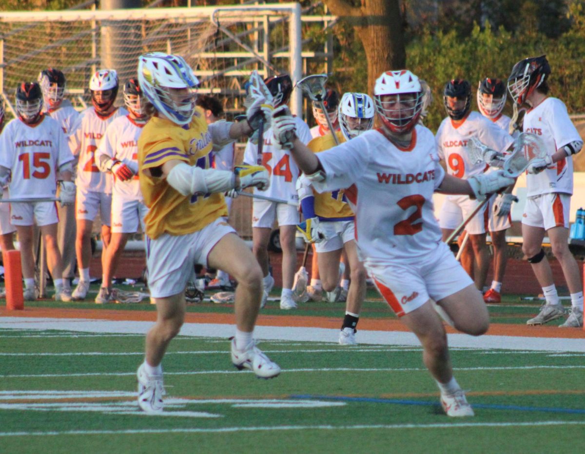 Sophomore+Logan+Tayfel+%282%29+takes+the+ball+into+Falcon+territory%2C+pursued+by+Wheaton+North+junior+midfielder+Sean+DeValk+%2815%29.+Logan+Tayfel+and+his+brother+Jacob+Tayfel+each+scored+once+in+the+game%E2%80%99s+second+quarter.+Logan+Tayfel+called+the+game%E2%80%99s+ending+an+%E2%80%9Camazing+finish+to+this+game+today.%E2%80%9D