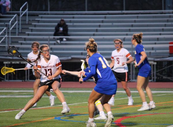 Senior Sophia Weick (13) pulls a spin move on the scattered Lake Forest defensive line. Weick, a captain of the team alongside senior Leah Chung, scored twice throughout the game.
