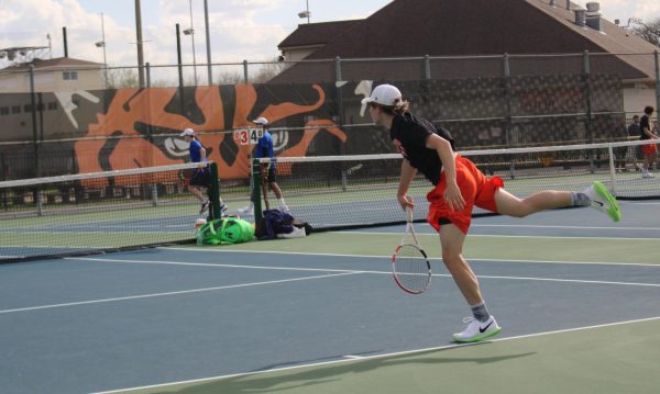 Senior co-captain Grant Angelbeck scores a point against the Blue Devils in the second singles match. Angelbeck, who won his sets 6-1 and 6-0, said that he is “looking forward to improving my consistency throughout this season.”