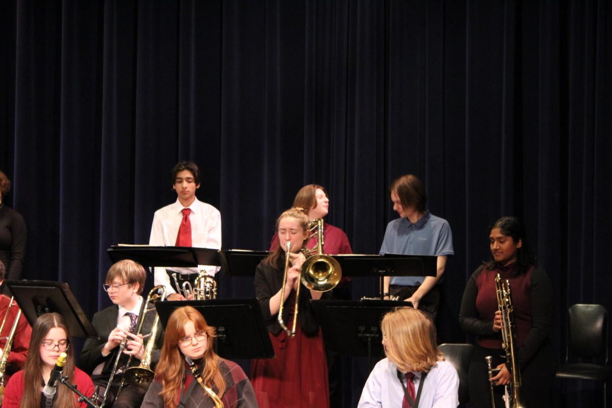 Senior Em Risman on the Trombone, plays for the Jazz Ensemble. She performed a solo in “Emancipation Blues”, trading back and forth with the other trombones.