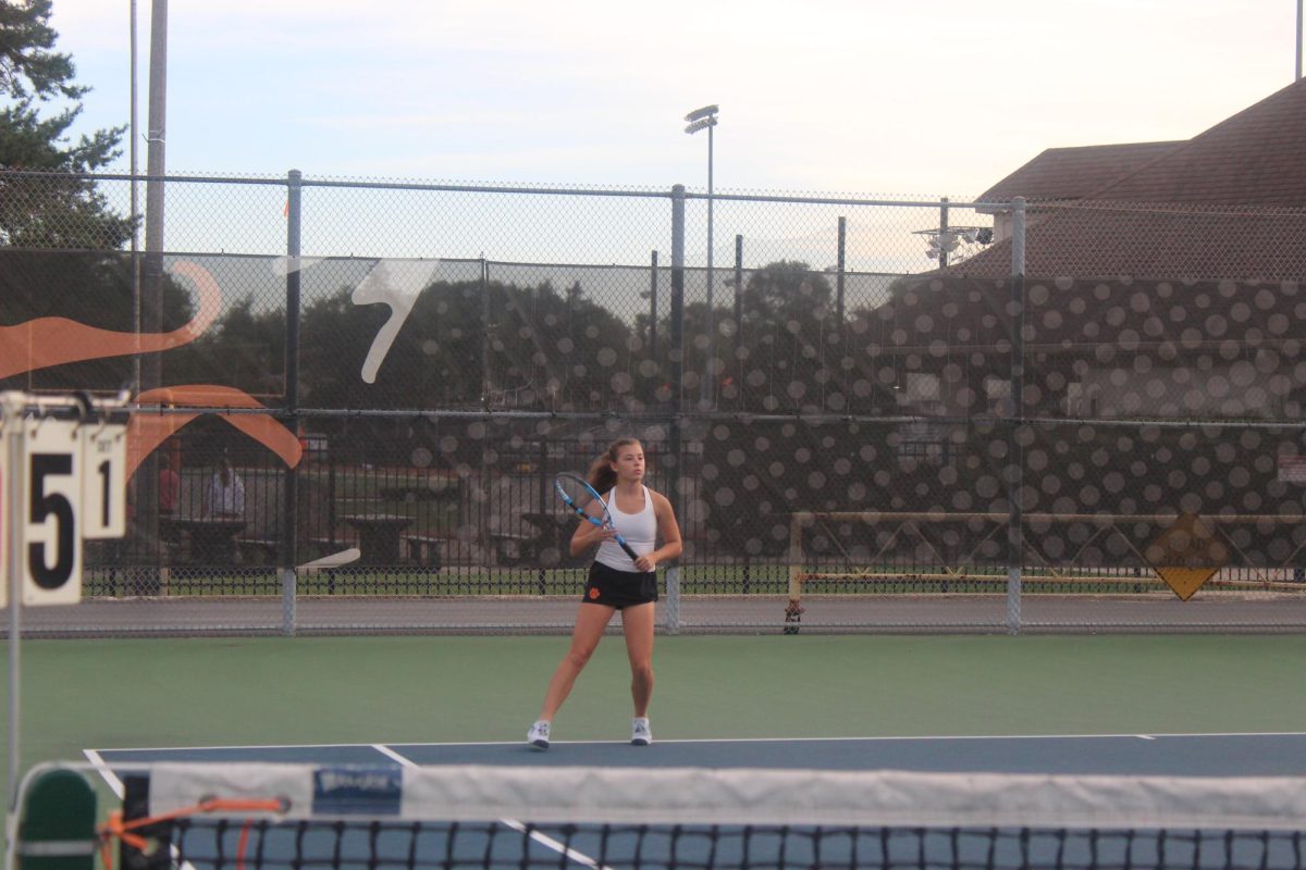 Senior Dakota Olsen braces herself in anticipation of the serve.
