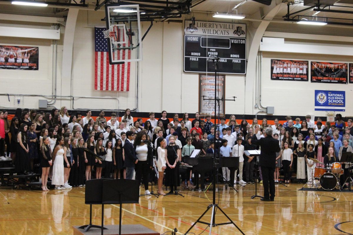 Middle School choir groups from Roundout, Highland and Oak Grove sing in the LHS Choir Festival. Dr. Brown, the Director of Choirs, conducts the middle school group. Four middle school soloists from Highland and Oak Grove sing their parts in “This Is Me” from The Greatest Showman. 