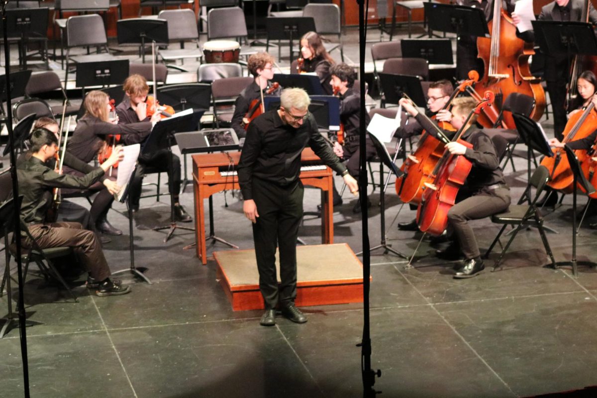 LHS conductor Jeremy Marino bows after the Concert Orchestra performs “Organ Concerto in A Minor”. Mr. Marino and guest conductor Ms. Frakes conducted the various orchestras in the Orchestra Festival on Thursday, December 5, 2024.