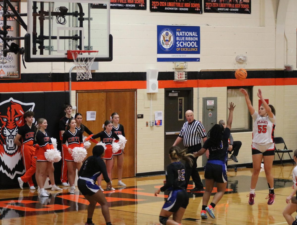 Senior Madison Sears (55) shoots in the third quarter of the game against Warren. 

