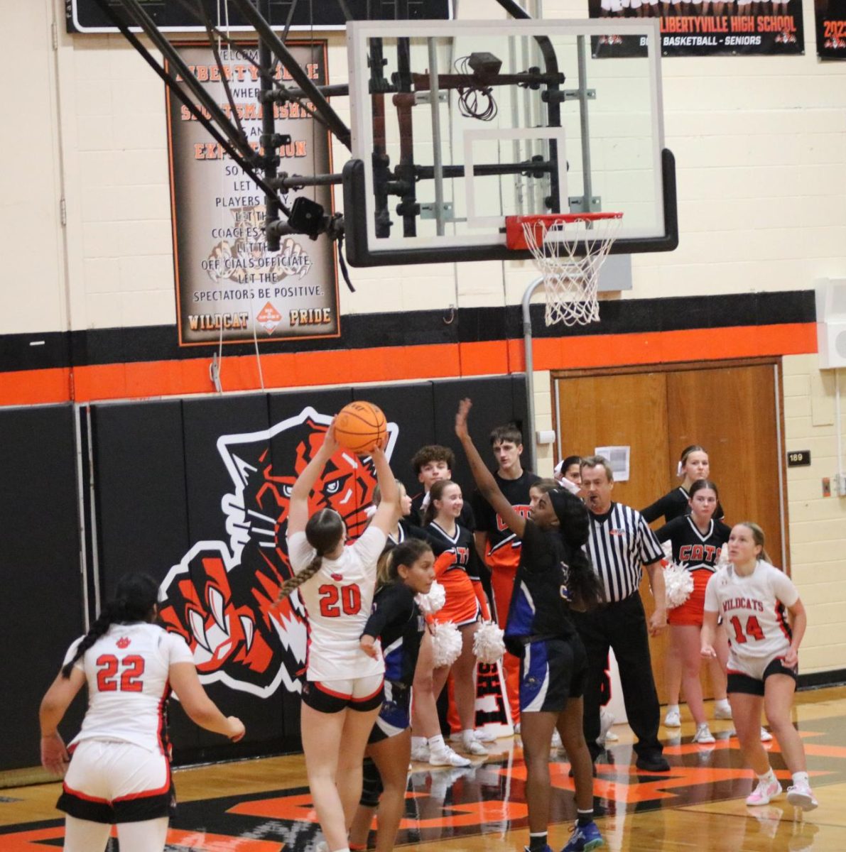 Sophomore Elle Knight (20) goes for a layup against Warren’s Small Forward Sophomore Kamaria Anderson. 
