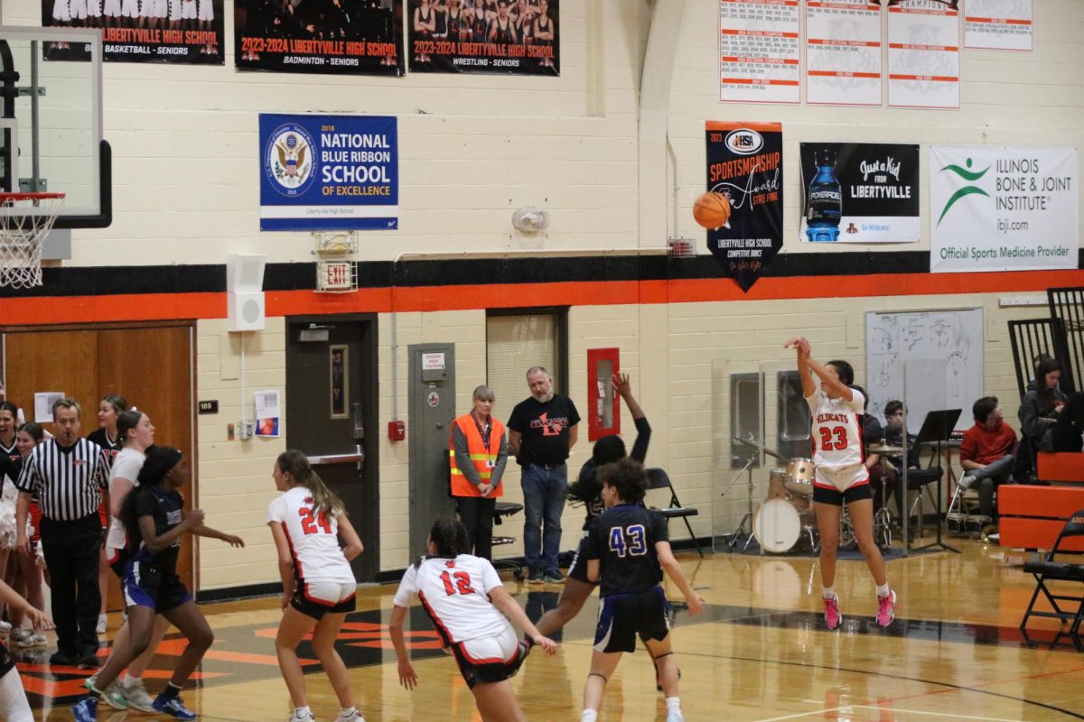 Sophomore KateRyan Castro takes a three-pointer in the fourth quarter. 

