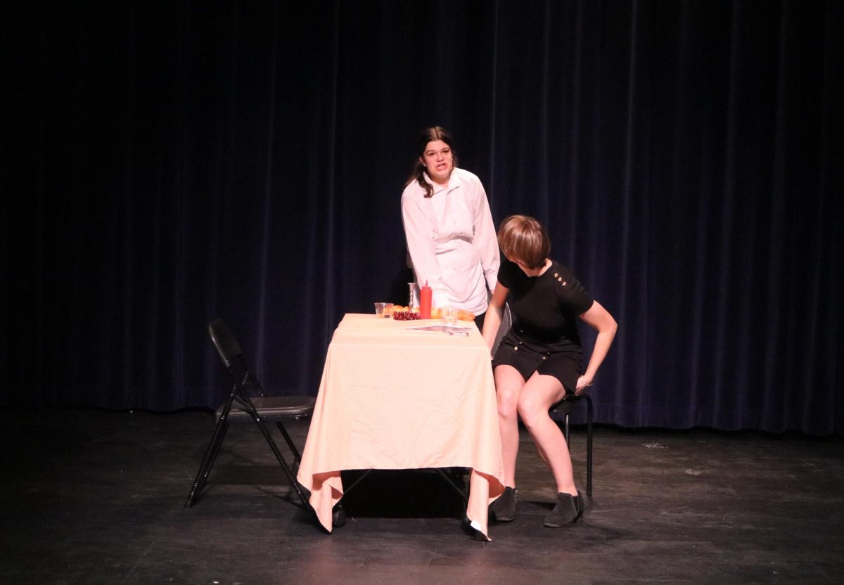 Junior Brooke Weintroub is featured as the waitress in “Check, Please” directed by juniors Kanoa Farias and John Zidek. The waitress, after witnessing a plethora of horrendous dates, eventually gets to watch love interests sophomore Jocelyn Herman and junior Luc Domingo-Snyder stumble upon each other and finally ask for their checks.