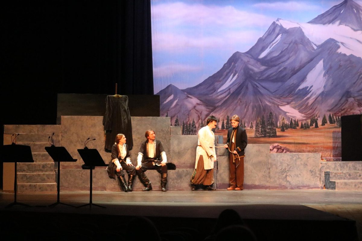 In Act 4, the whimsical character Azdak, played by Rosie Wagner, is introduced. After taking part in a Mock Trial, Azdak is made a court judge — despite his lack of intellect in that field.