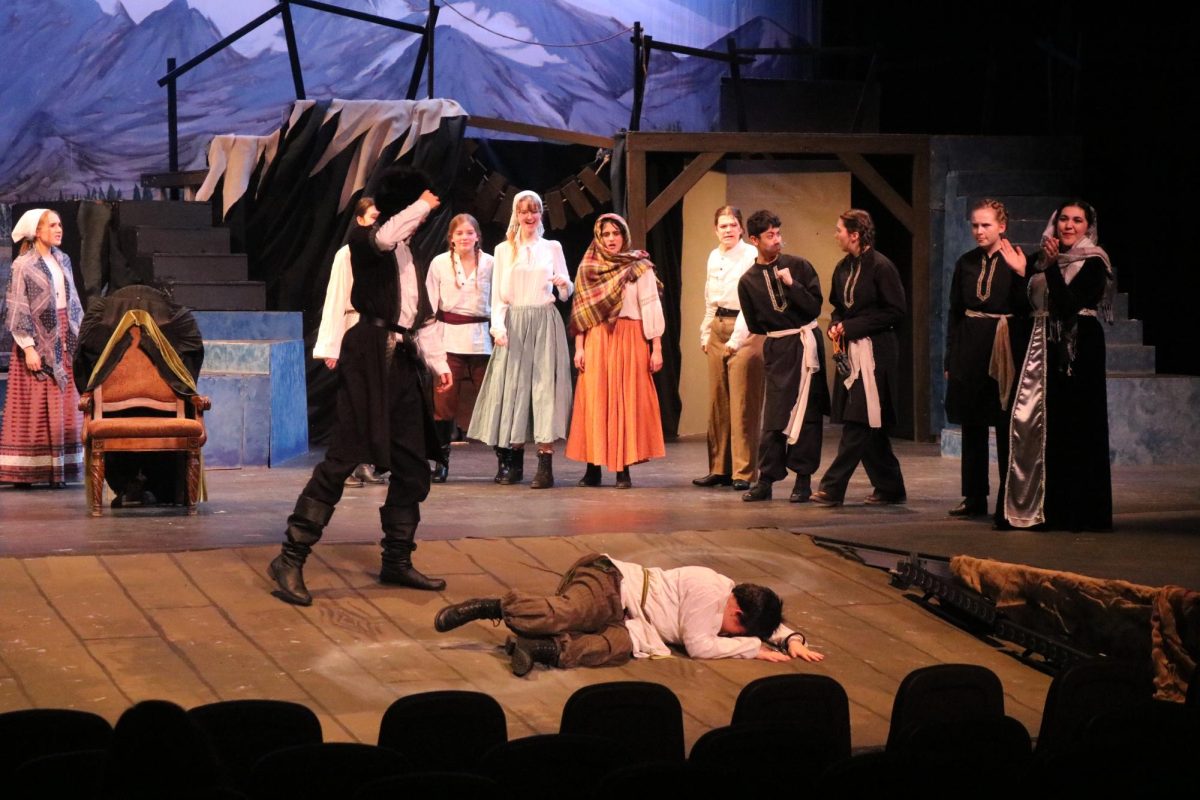 As seen a few years later, Grusha, Natella, and Michael (who is now a toddler) arrive at Azdak’s Court. The war is over and both the Governor’s Wife and Simon (Grusha’s lover) have returned from war. Meanwhile, Azdak gets beaten up by the Ironshirts, played by senior Jake Potter and junior Maddie Pierce, for his nonsensical trials and bizarre judging. 