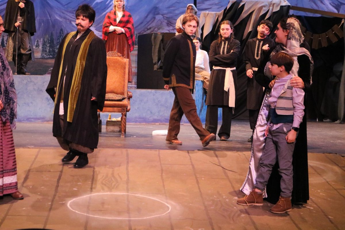 The Governor’s Wife pulls Michael out of the chalk circle. The process of the Chalk Circle is repeated, and once again, the Governor’s Wife ends as the victor. Things aren’t looking good for Grusha. Despite this, Azdak, the judge, gives Michael to Grusha instead out of sympathy for Grusha. 