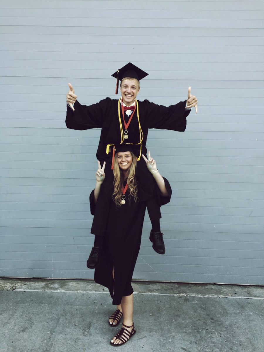 Mr. Dean and his friend Sarah pose for a photo together at their high school graduation. They both graduated in 2015. “I really had such an amazing experience [and] I had a great group of friends,” Mr. Dean said. (Photo courtesy of Mr. Dean)