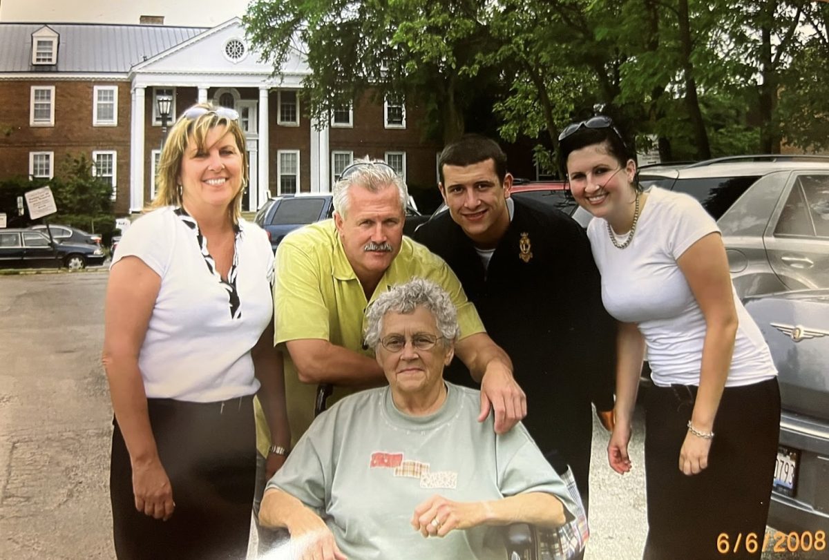Mr. Eric Brzezinski (back right) poses for a photo with his family at his high school graduation. He had a positive experience at LHS after transferring as a freshman from Vernon Hills. “Each day was exciting, whether [it was] playing sports or going into school or doing the prep rallies,” he said. (Photo courtesy of Mr. Eric Brzezinski)