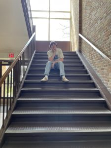 The window at the top of the staircase by the auditorium lets in tons of natural light and provides students with a scenic view of the school's entrance.