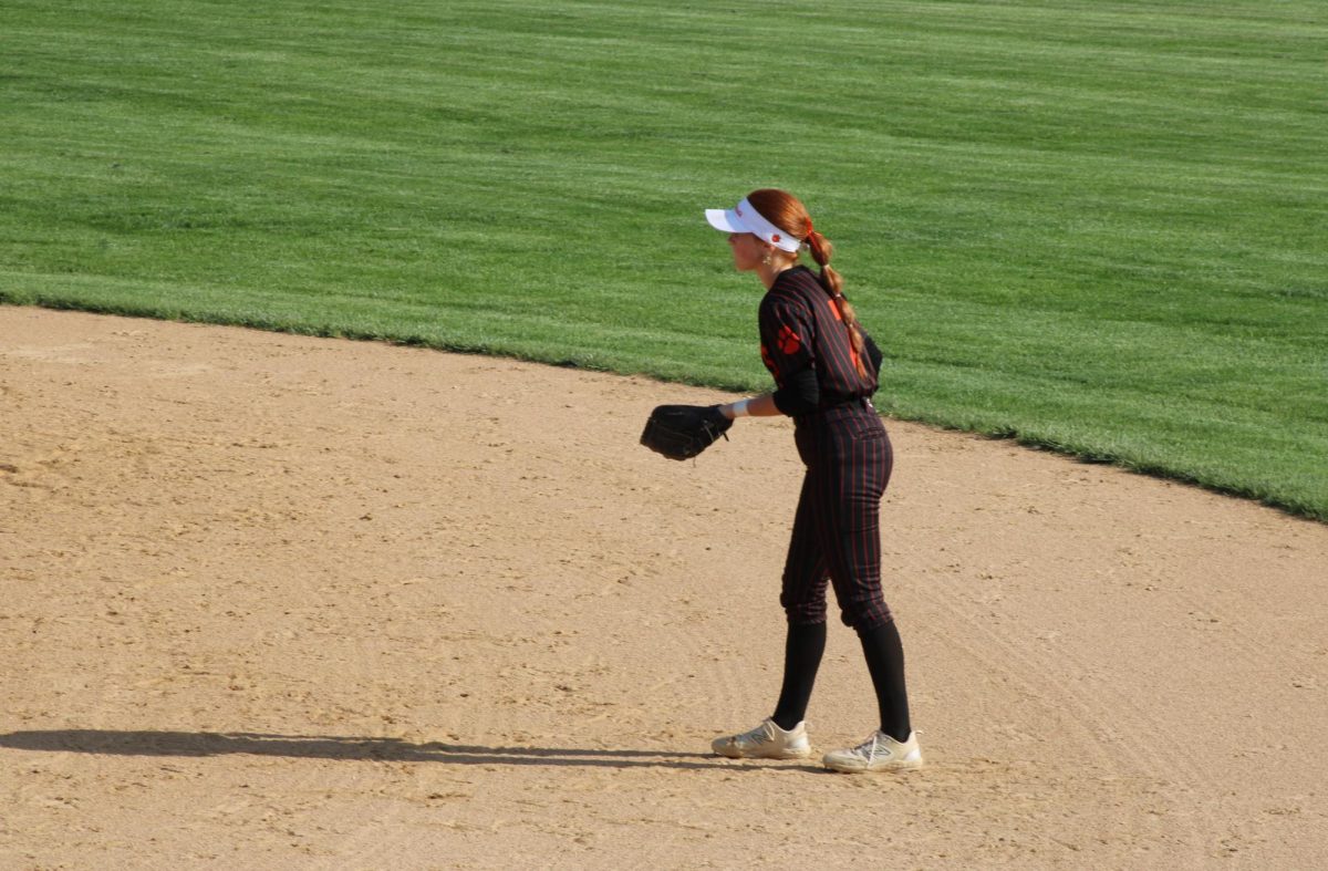 Senior Callie Hill (7) watches as the Mustangs step up to bat in the beginning of the second inning. By the end of the inning, the score was 0-2; however, the Wildcats turned the game around entirely at the tenth inning.