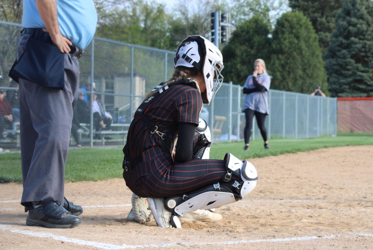 Junior Maddy Kleeman (3) waits as the pitcher walks back to the mound after an out. This is Kleeman's third year on varsity.