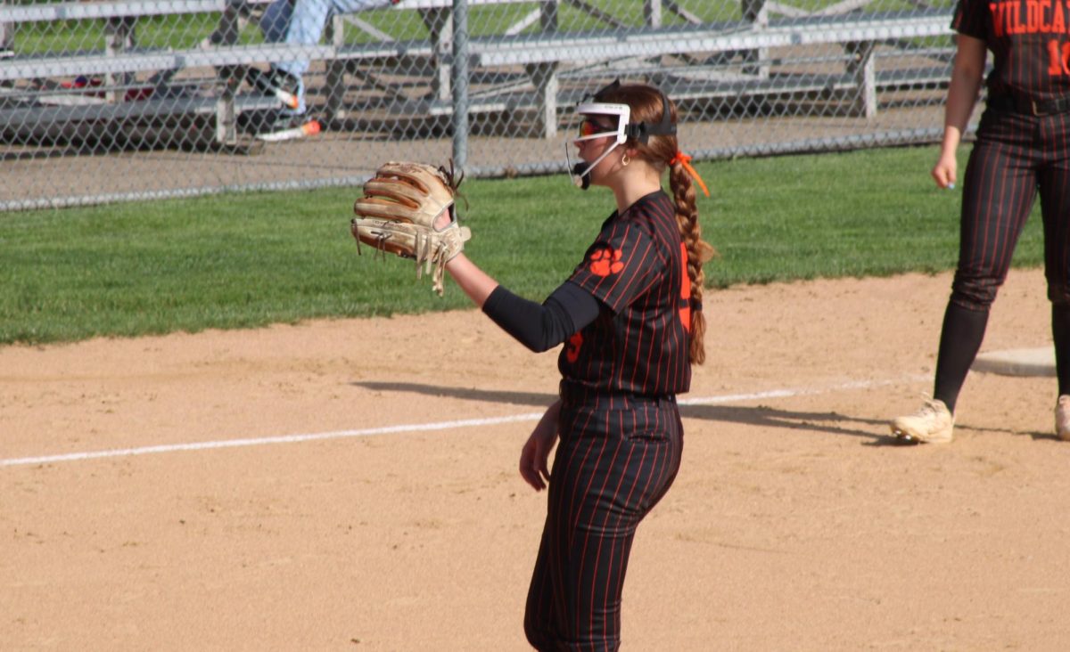 Freshman pitcher Mckenna Weaver (9) catches the ball after a strike. Weaver is one of the two freshmen on varsity, alongside Juliana Figurelli (4).