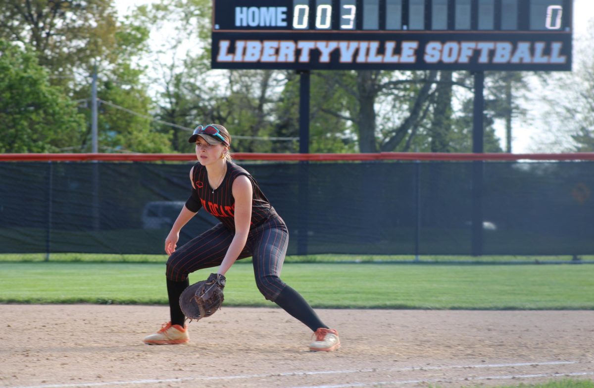 Senior first baseman Siena Zombolo (2) positions herself in anticipation of catching the ball in the third inning.