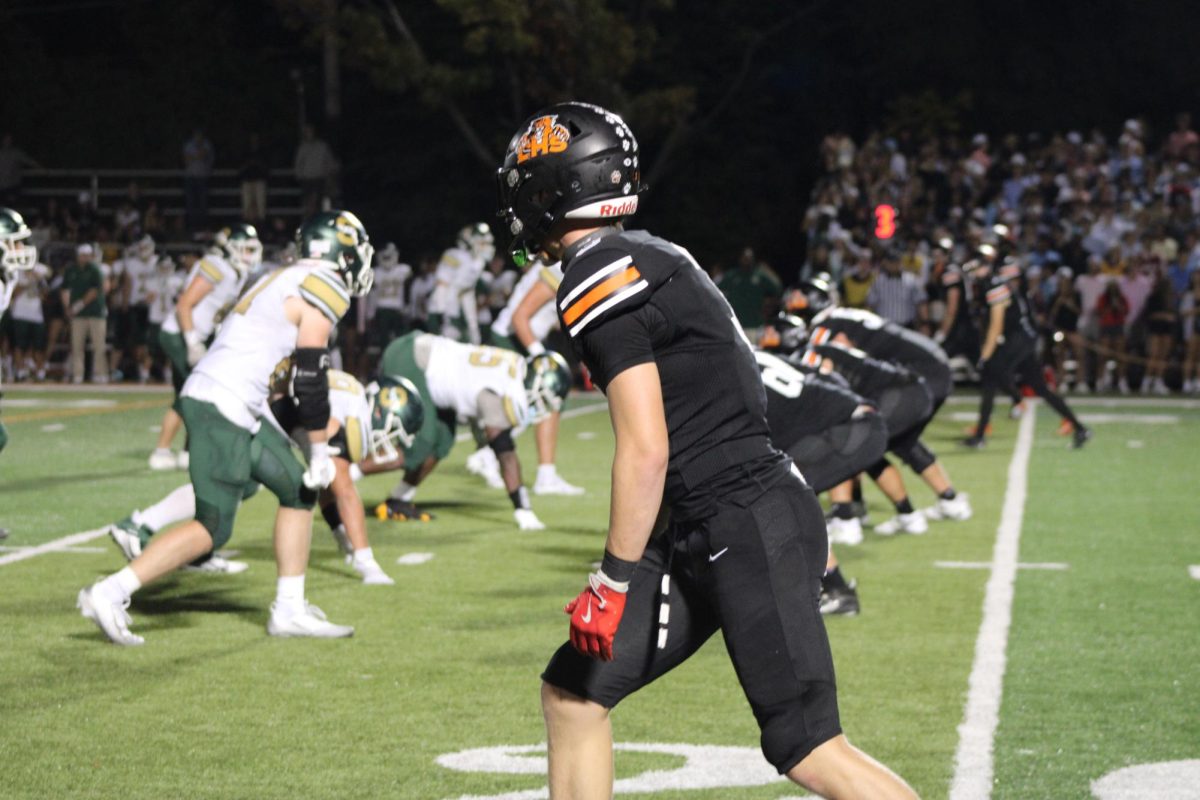 Junior tight end Brock William (3) waits for the quarterback to signal the start of the play. Williams scored the only touchdown for Libertyville during the third quarter. 