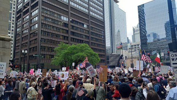 Protestors march down the streets of Chicago around 1:30 p.m. after a gathering in Grant Park. Tens of thousands of protesters participated, outnumbering the 15,000 estimated protestors who attended the rally in June this year. Mayor Brandon Johnson and Gov. JB Pritzker spoke before the march. (Photo Courtesy: Wikimedia Commons)