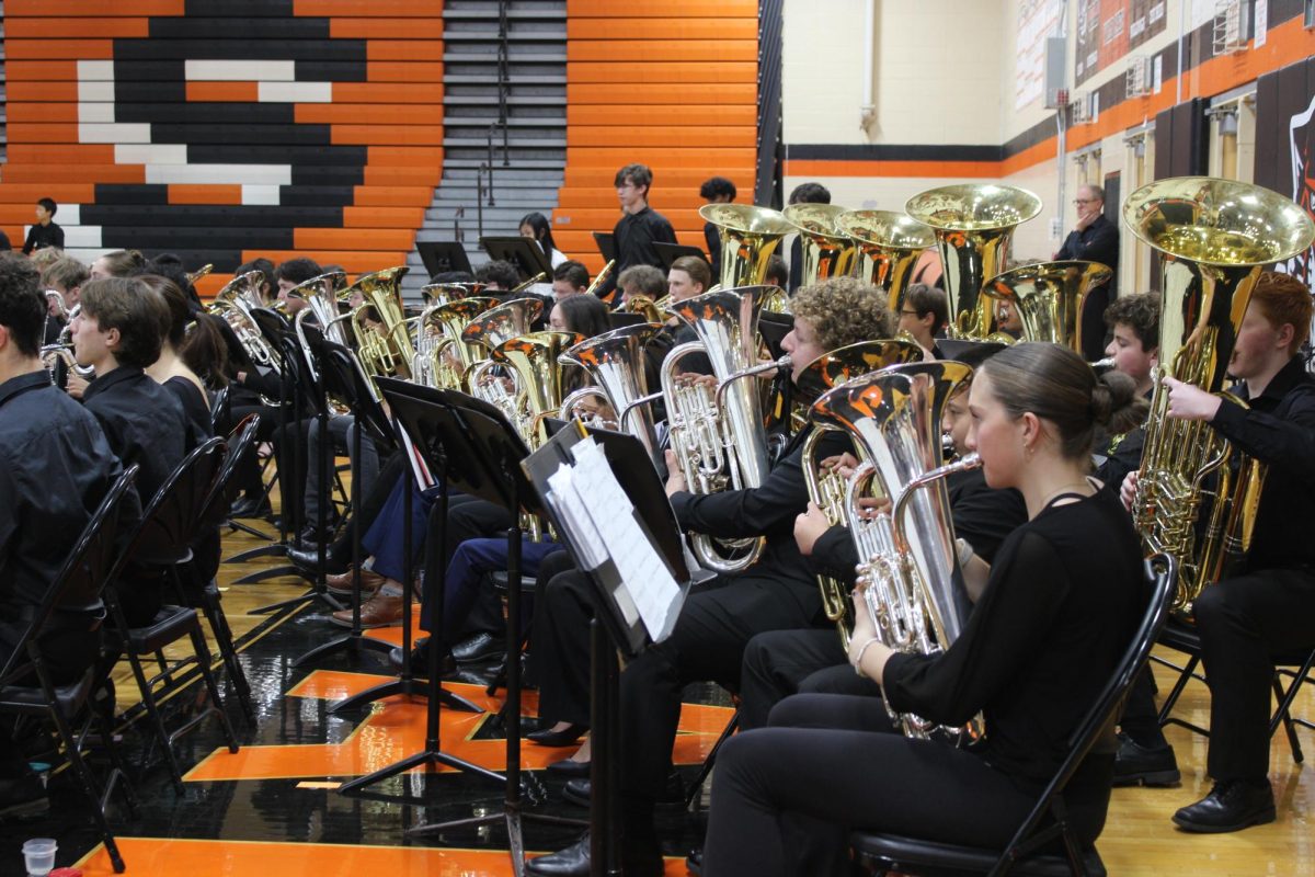 LHS Euphoniums and tubas in the mass band setup conducted by Randy Sundell . After each LHS band performance they would transfer to their mass band positions to make the transition easier for the end of the concert. “I think the biggest challenge is the logistics of getting one band from one setup to the next and the amount of time that it takes,” said Helvie.