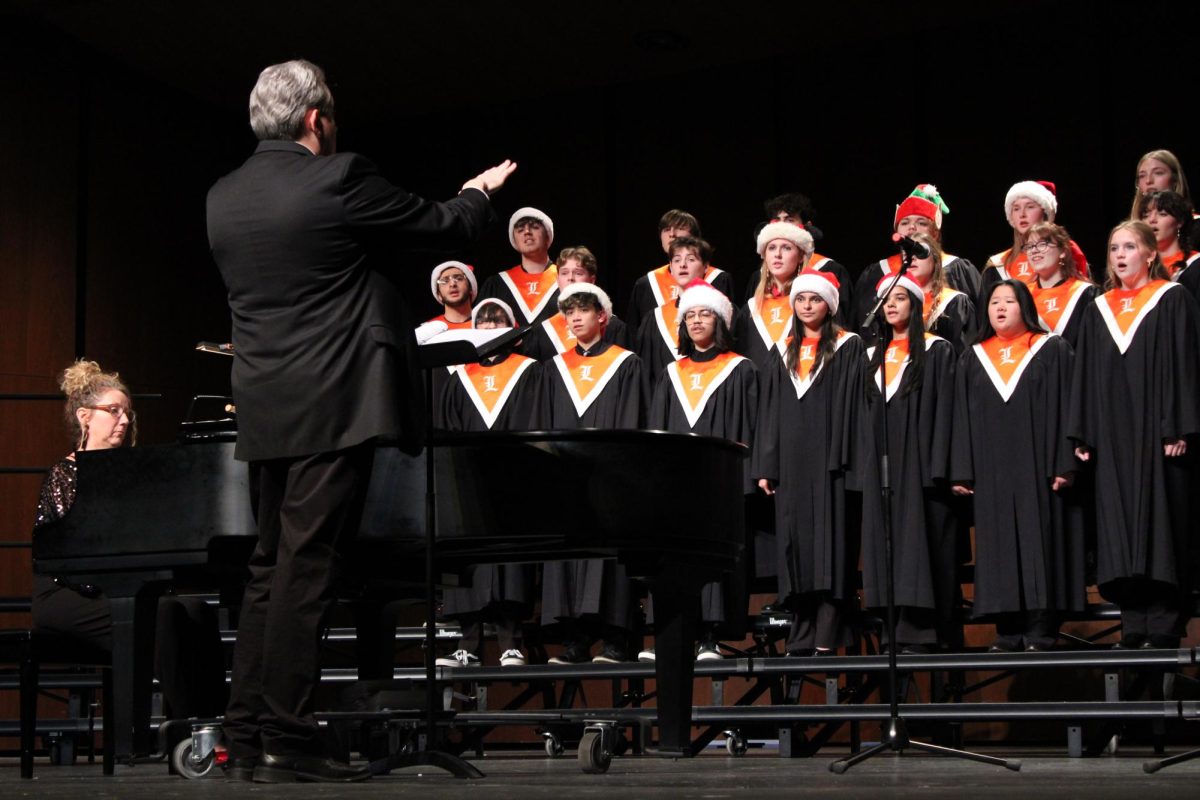 Dr Brown leads the Concert Choir in an arrangement of "Where the River Meets the Sea" by Paul Williams, a lesser known holiday hit from a 1970s Muppet's Christmas Special.
