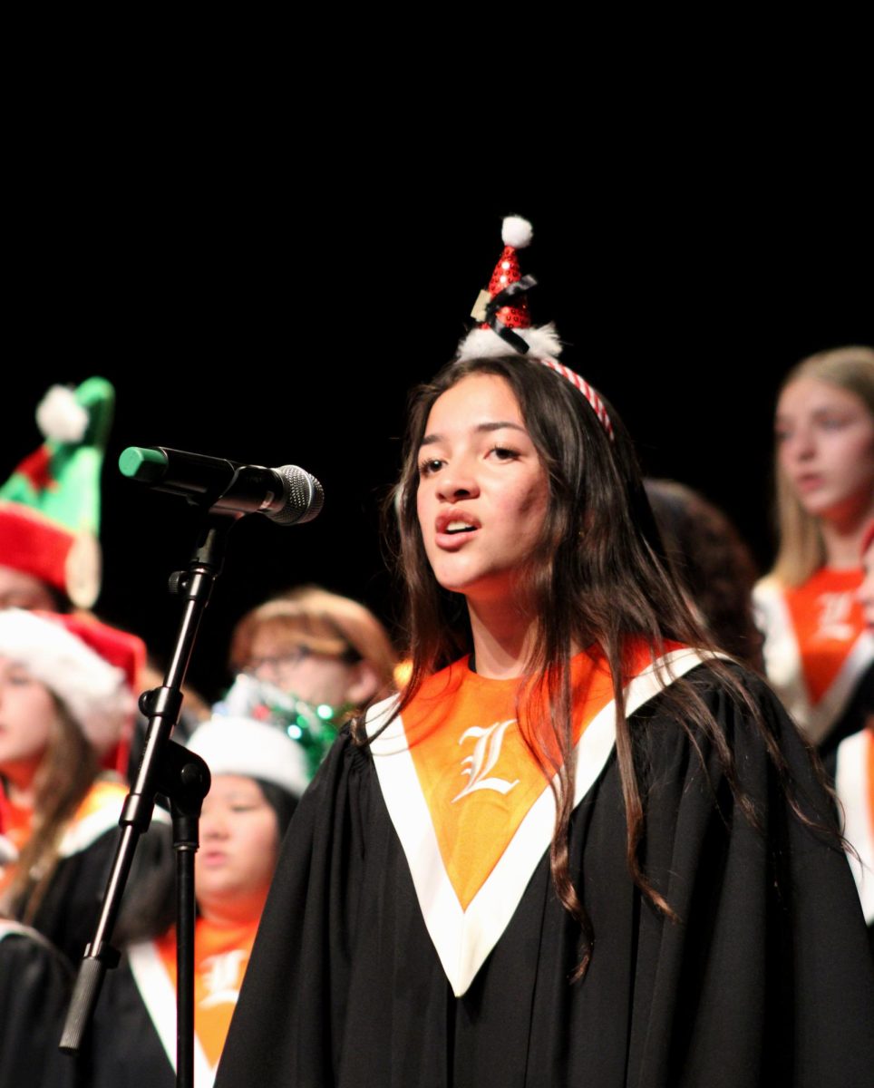 Senior soloist Alice Krietsch of the Concert Choir sings "The First Noel" by Darmon Meader. Krietsch is one of the three soloists in the entire concert.