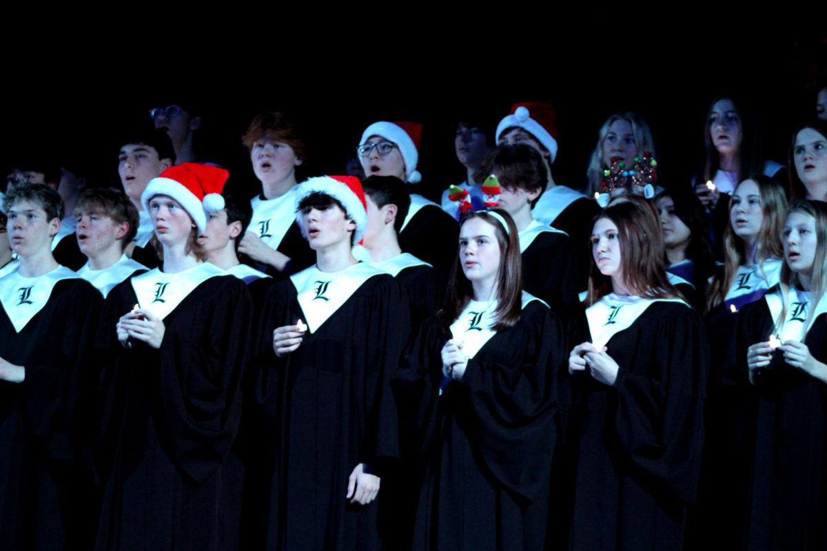 Underclassmen stay on stage to sing "Silent Night" by Franz Gruber while upperclassmen line the aisles. Ending with this song is a tradition in which the lights are dimmed and each choir member holds a lit candle.