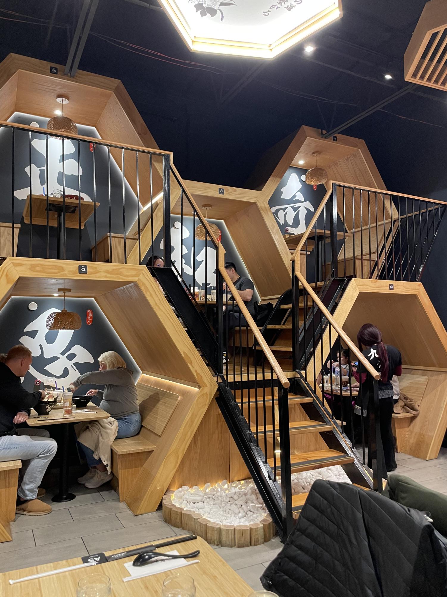 Kyuramen’s signature honeycomb seating on one wall offers cozy seating, with stairs to connect each. Diners can also choose private rooms with curtains or traditional tables. “I really liked the honeycomb seating that they had,” one customer said. “It was like bunk beds. And I thought that was cool.”