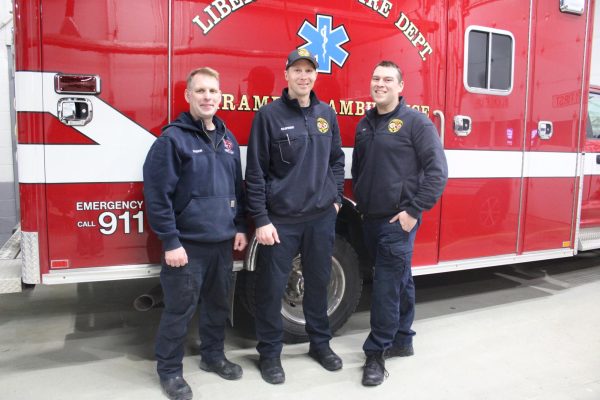 First responders work on a one day on two day off schedule to allow for 24/7 coverage while helping to reduce burnout and promote recovery. (From left to right) First responders Brian Bagdon, Dave Naspinski and Joe Moya stand in front of one of the signature red and white Libertyville ambulances.
