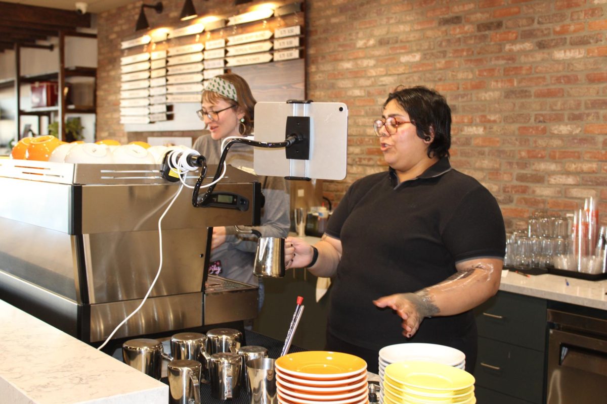 Baristas Lily McCann-Klausz (left) and Natt Ramirez (right) prepare drinks for customers, ranging from specialty lattes like Mrs. Nitti’s Cookies Latte to iced teas. “Our drinks are mainly from Tala,” co-owner Ivy Sukenik said. “We felt that their beans are so high quality, and they’re incredible partners.”