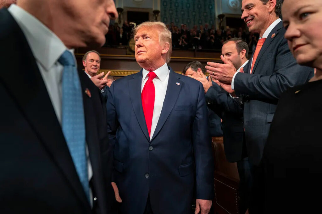 President Trump receives a warm welcome from the Republican Party before his State of the Union Address. During the speech, multiple lawmakers on the Democratic side of the chamber interrupted in protest, disputing his claims about immigration and pointing to the recent fatal shootings involving U.S. Immigration and Customs Enforcement officers in Minneapolis that were not mentioned in his remarks. (Photo Credit: Paper box)
