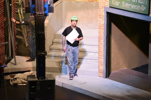 Mr. Kevin Holly works on the stage of the 2017 All State Production of “In the Heights” at the Illinois High School Theatre Fest (IHSTF) as Lighting Director.