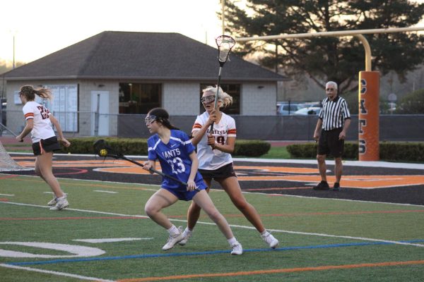 Senior Teona Markoska (19) fights back against an offensive Giant. Markoska's strong defensive presence and skill helped limit the Giants to just four goals.